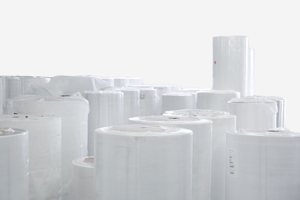 Rolls of non-woven fabric packed